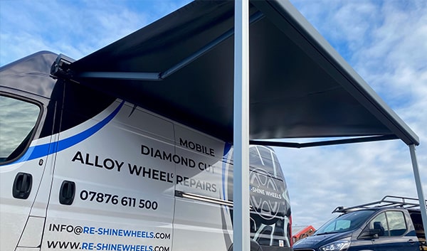 black fiat van awning unfurled