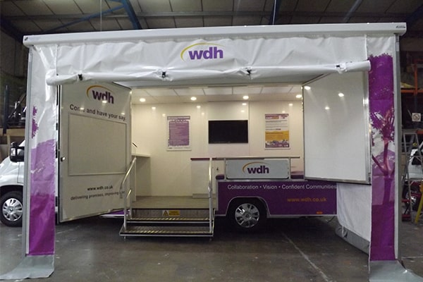 white and purple luton van awning with side enclosures